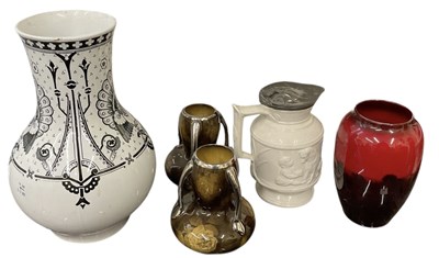 Lot 607 - ROYAL DOULTON; a flambé glazed vase, decorated...