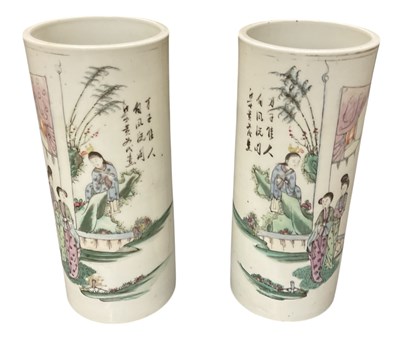 Lot 1016 - A pair of Chinese Famille Rose sleeve vases,...