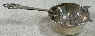 Lot 448 - An Elizabeth II hallmarked silver tea strainer...