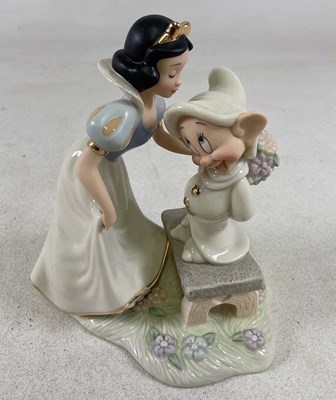Lot 165 - LENOX; Snow White and Dopey figure group,...