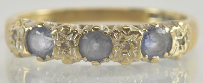 Lot 1349 - A 9ct gold ring set with three cut sapphires...