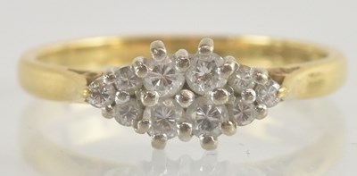 Lot 1250 - An 18ct gold diamond set cluster ring, size J,...