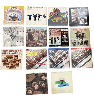 Lot 327 - THE BEATLES; a collection of fourteen Beatles...