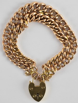 Lot 1333 - A 9ct rose gold double row bracelet, united by...