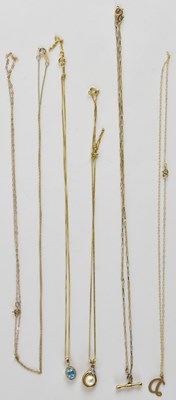 Lot 1283 - Six dainty 9ct gold necklaces, four with...