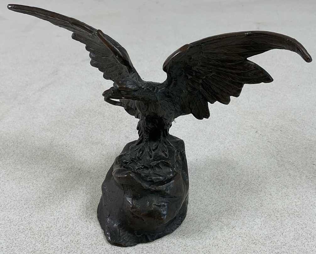 Lot 135 - AFTER THE ANTIQUE; a bronze pocket watch stand...