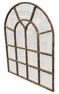 Lot 52 - A modern rustic dome top wall mirror modelled...