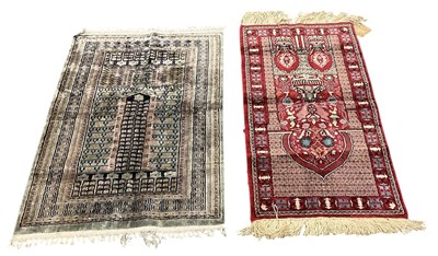 Lot 95 - A Tunisian silk hand woven red ground prayer...