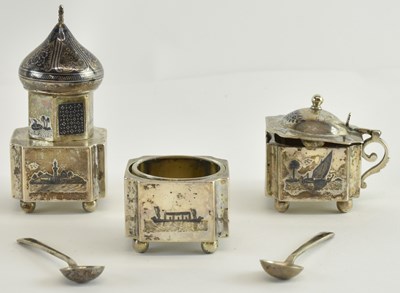 Lot 1143 - An Indian white metal and niello work three...