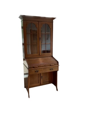 Lot 51 - An early 20th century oak roll top bureau...