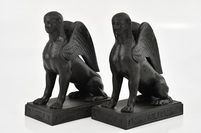 Lot 1624 - WEDGWOOD; a pair of black basalt models of...