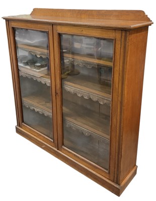 Lot 32 - A late 19th/early 20th century oak bookcase,...