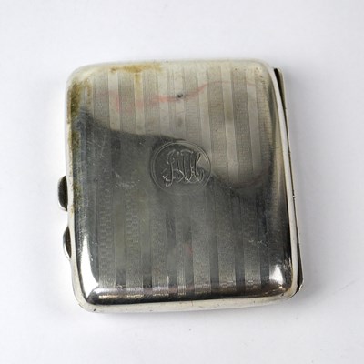 Lot 837 - A hallmarked silver engine turned cigarette...