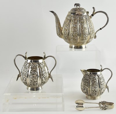 Lot 1089 - An Indian white metal three piece tea service,...