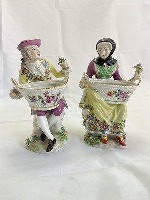 Lot 220 - A pair of 19th century porcelain figural salts,...