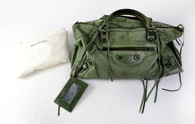 Lot 214 - BALENCIAGA; a green leather handbag with...