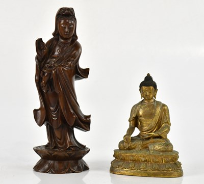 Lot 2346 - A good Tibetan bronze model of a seated...