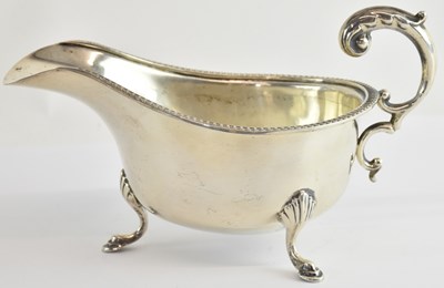 Lot 1135 - A George V hallmarked silver sauceboat,...
