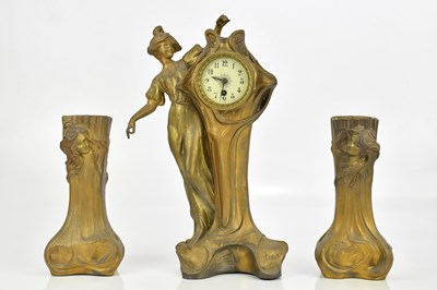 Lot 73 - An Art Nouveau bronzed spelter three piece...