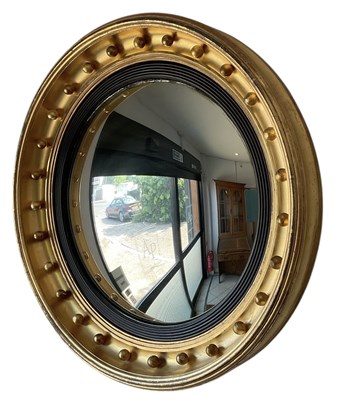 Lot 24 - A 19th century circular gilt framed convex...