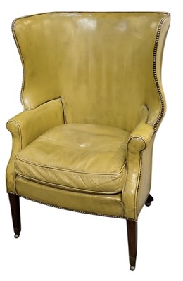 Lot 10 - An early 19th century barrel back armchair,...