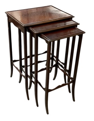 Lot 62 - An early 20th century mahogany nest of three...