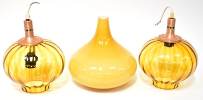 Lot 67 - A pair of 1970s amber glass ceiling lampshades...
