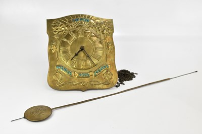 Lot 87 - An Arts & Crafts sheet brass wall clock...