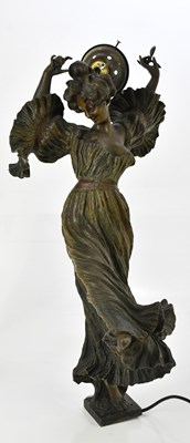 Lot 68 - E FLORA; a large bronze lamp representing a...