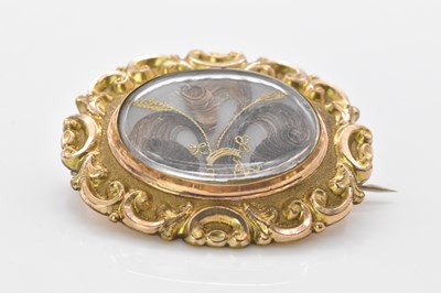 Lot 983 - A Victorian yellow metal mourning brooch, with...