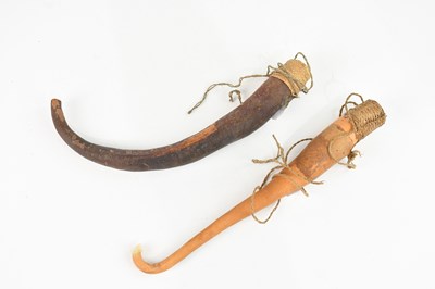 Lot 1528 - Two Papua New Guinea penis gourds, largest 27cm.