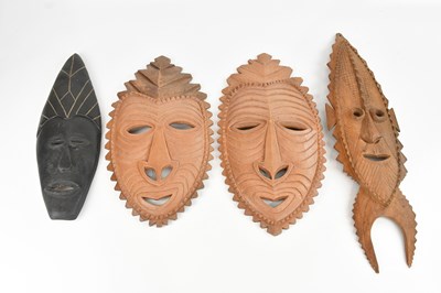 Lot 1543 - Three reproduction Papua New Guinea wall masks...