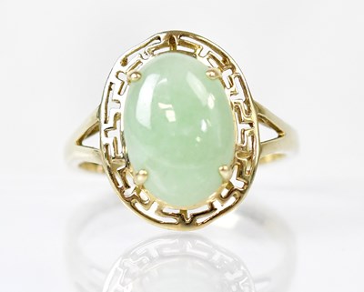 Lot 809 - A 9ct yellow gold ring set with a pale green...