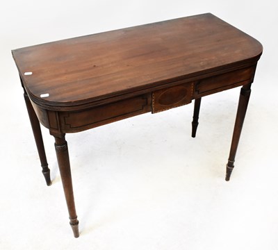 Lot 83 - A 19th century mahogany fold-over tea table...