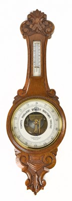 Lot 1518 - B.F AMERICAN OPTICAL COMPANY BRUSSELS; an early 20th century carved oak barometer