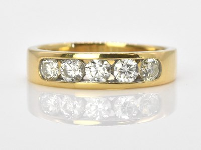 Lot 644 - An 18ct yellow gold five stone diamond ring,...