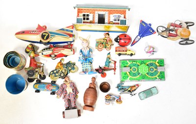 Lot 650 - Tinplate toys, including a bungalow, a Russian...