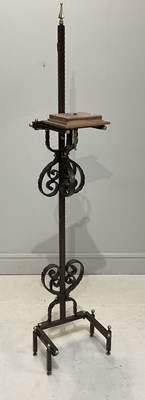 Lot 1288 - A wrought iron plant stand, height 235cm.