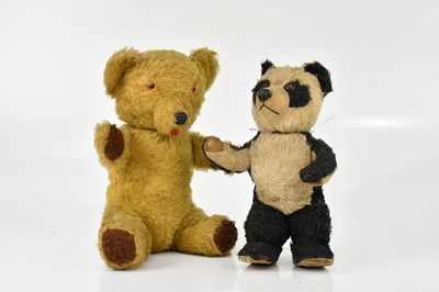 Lot 2073 - A vintage plush musical teddy bear and a plush...