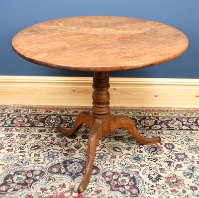 Lot 2849 - A George III oak circular occasional table, on...