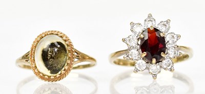 Lot 1339 - A 9ct yellow gold cluster ring set with a...