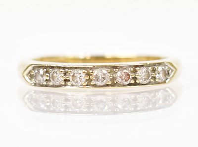 Lot 1349 - A 9ct yellow gold ring set with single row of...