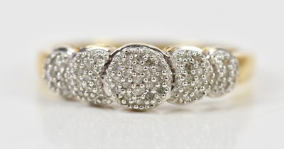 Lot 2575 - A yellow metal dress ring set with a melee of...