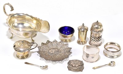 Lot 1097 - REID & SONS; an Edward VII hallmarked silver sauce boat