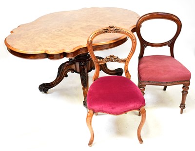 Lot 35 - A Victorian walnut tilt-top dining table of...