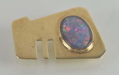 Lot 1469 - A gold contemporary brooch with a large oval...