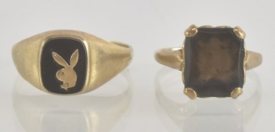 Lot 1276 - Two 9ct gold rings, one example with a black...