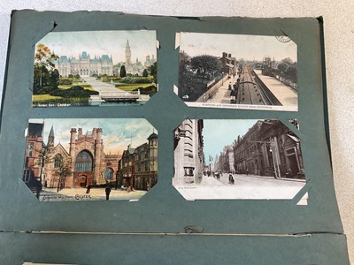 Lot 2098 - A postcard album containing approximately five...