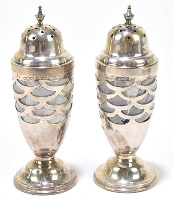 Lot 1169 - MARPLES & CO; a pair of Edward VII hallmarked silver pepperettes