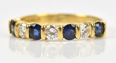 Lot 2437 - An 18ct yellow gold diamond and sapphire seven...